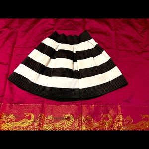Black and white striped formed skirt perfect for casual or an elegant night out